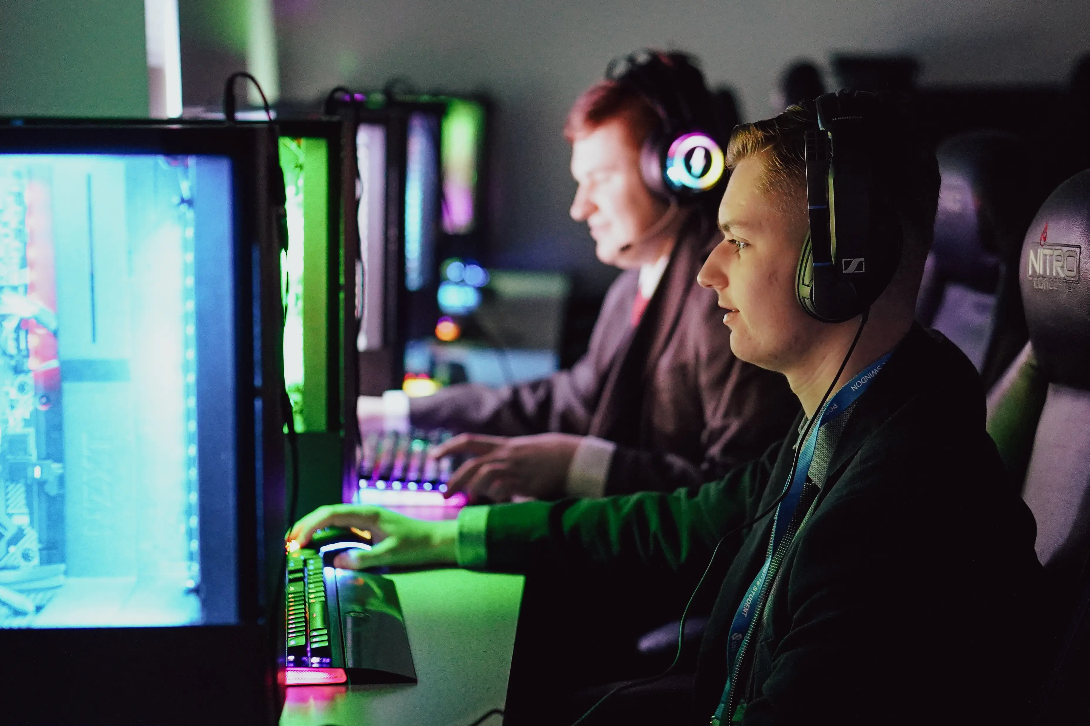 Students competing at gaming PCs during an esports event