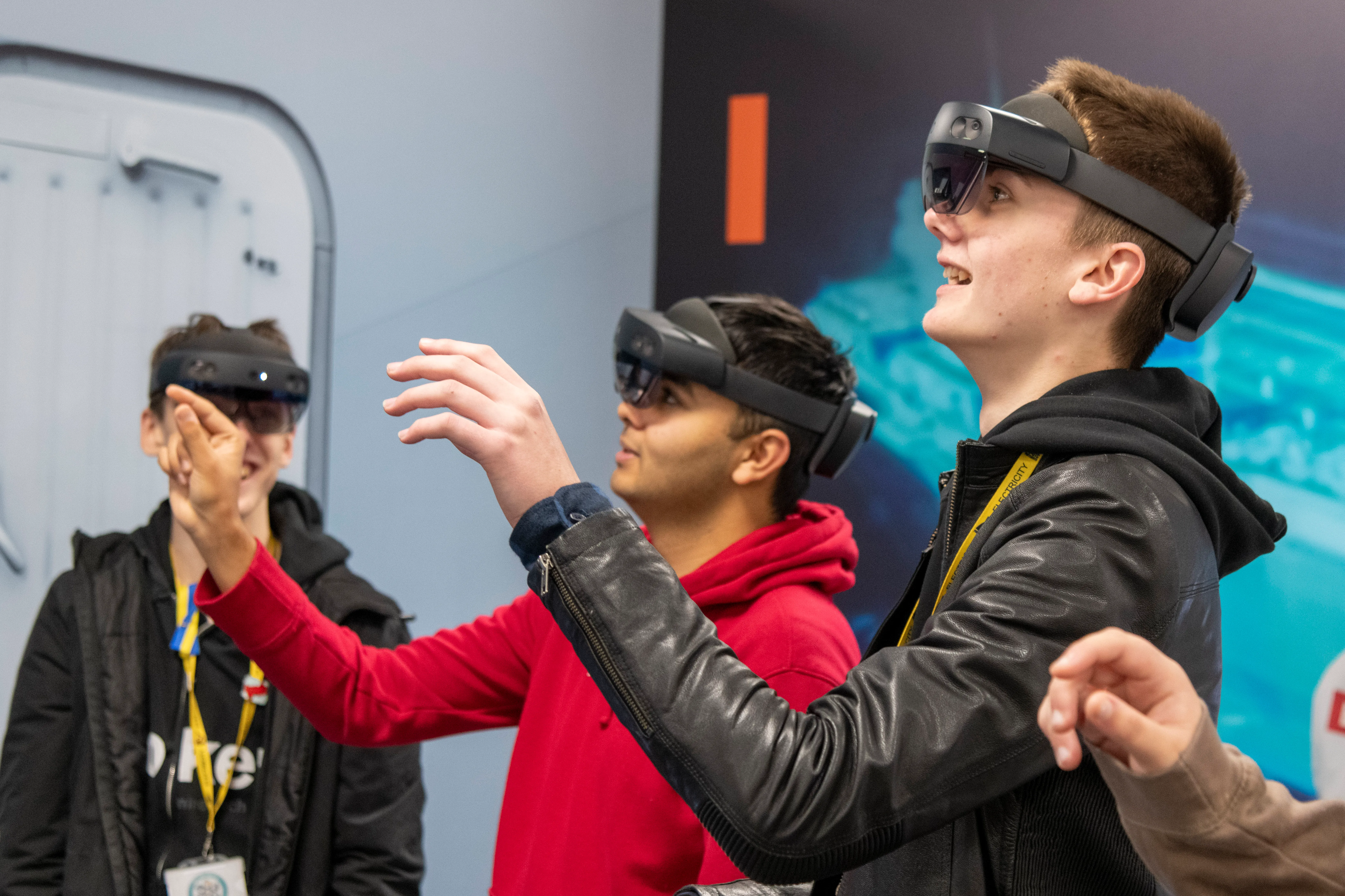 Students using mixed-reality headsets during a hands-on exercise